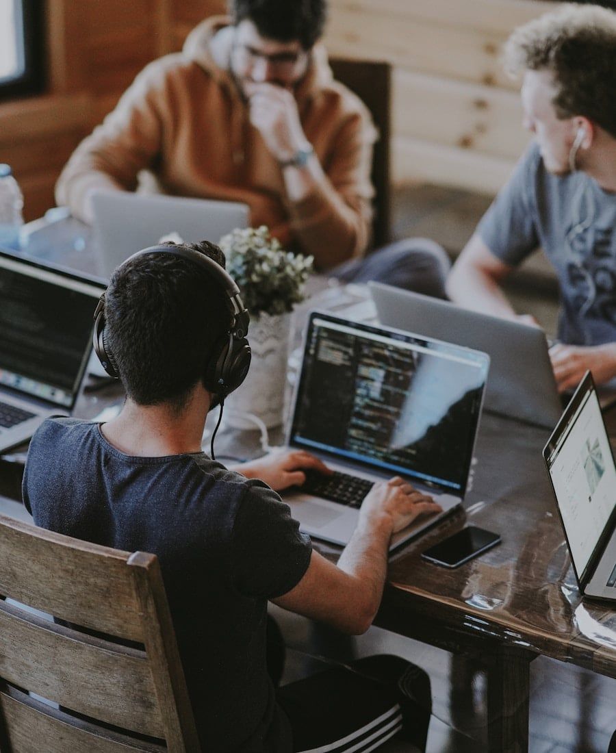 SEO Strategist — LoudCrowd strategy team collaborating around a laptop
